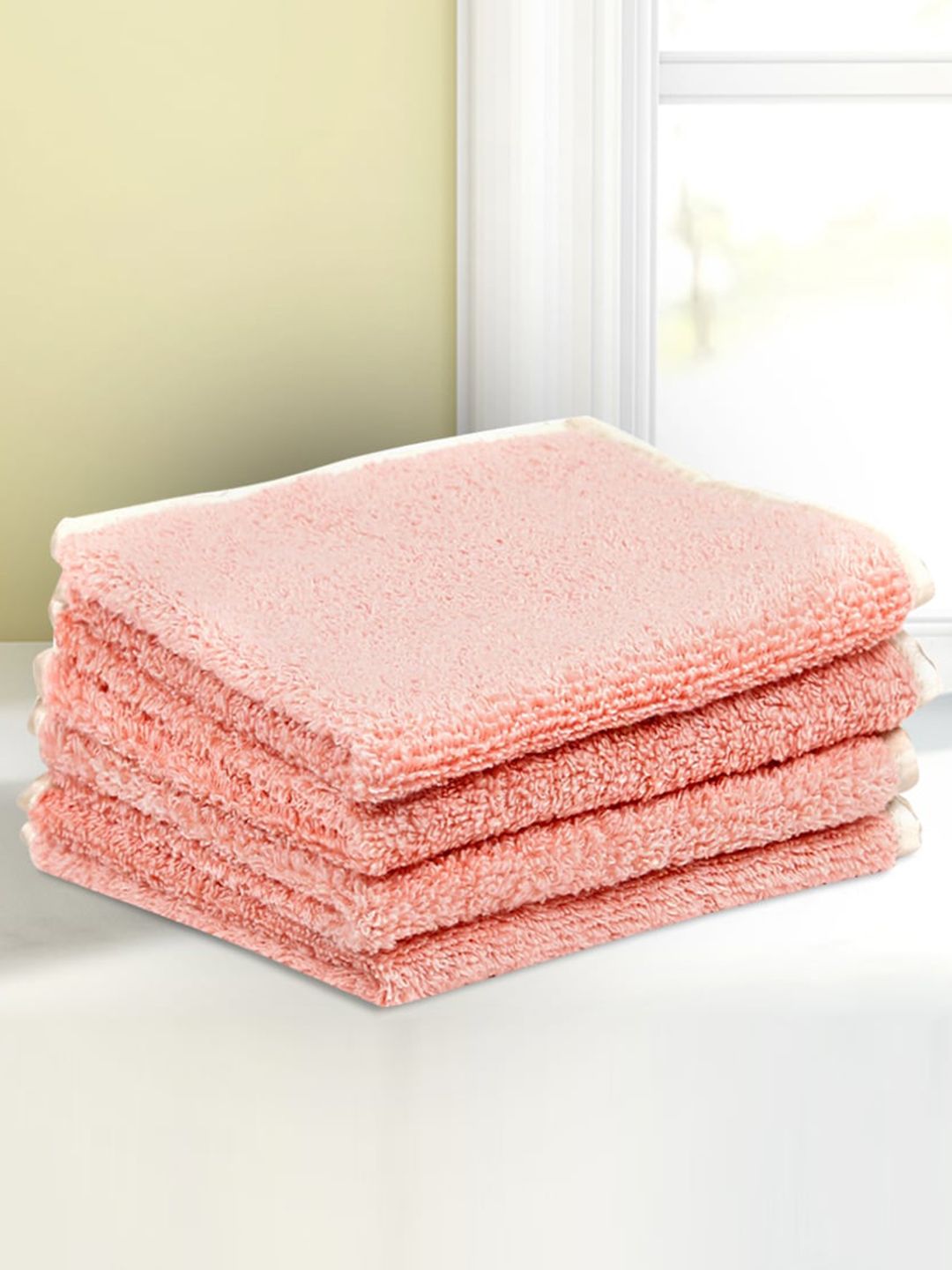 LUSH & BEYOND Set Of 4 Peach Solid 500 GSM Pure Cotton Face Towels Price in India