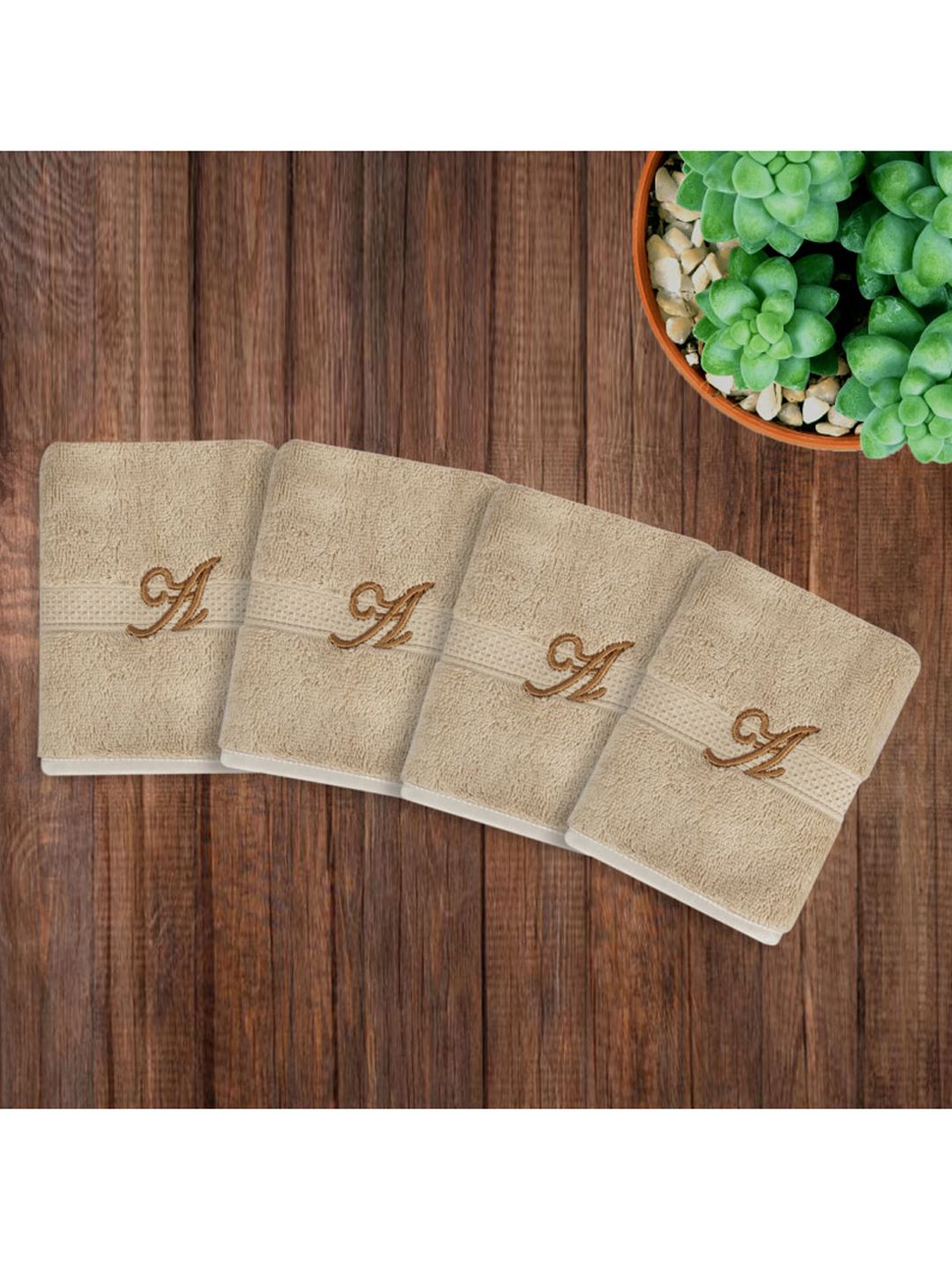 LUSH & BEYOND Set Of 4 Beige 500 GSM Solid Cotton Face Towel Price in India