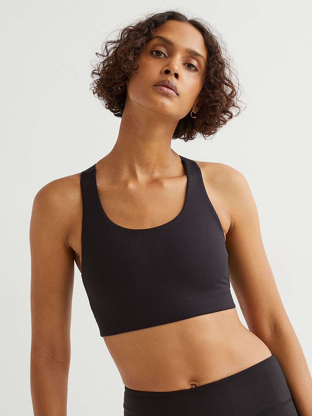H&M Black Solid High Support Sports Bra Price in India