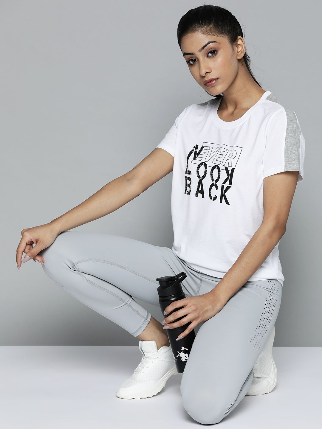 Alcis Women White & Black Typography Printed Slim Fit Training or Gym T-shirt Price in India