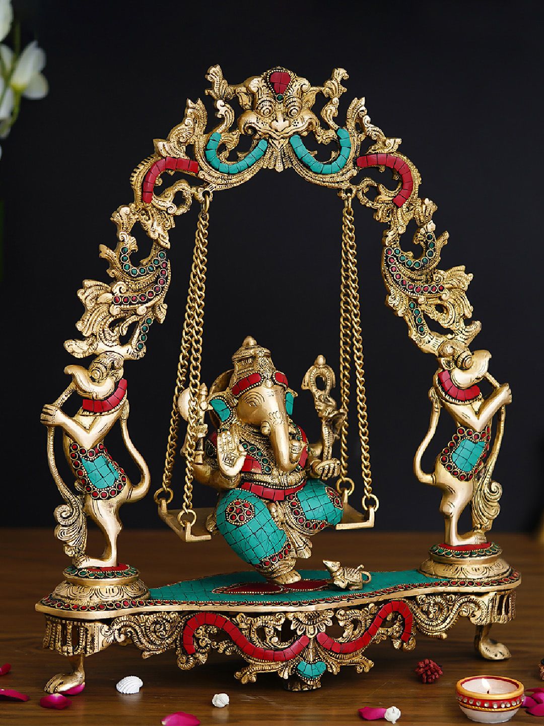 eCraftIndia Golden, Red, and Green Colored Lord Ganesha on a Swing Handcrafted Idol Price in India