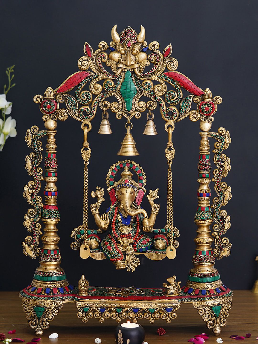 eCraftIndia Golden Lord Ganesha on a Decorated Swing Handcrafted Brass Idol with Stone Work Showpiece Price in India