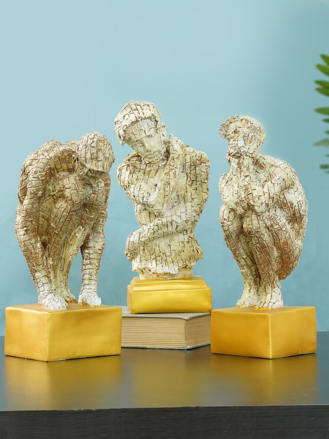 TIED RIBBONS Set Of 3 Beige & Gold-Toned  Man Statue Showpieces Price in India