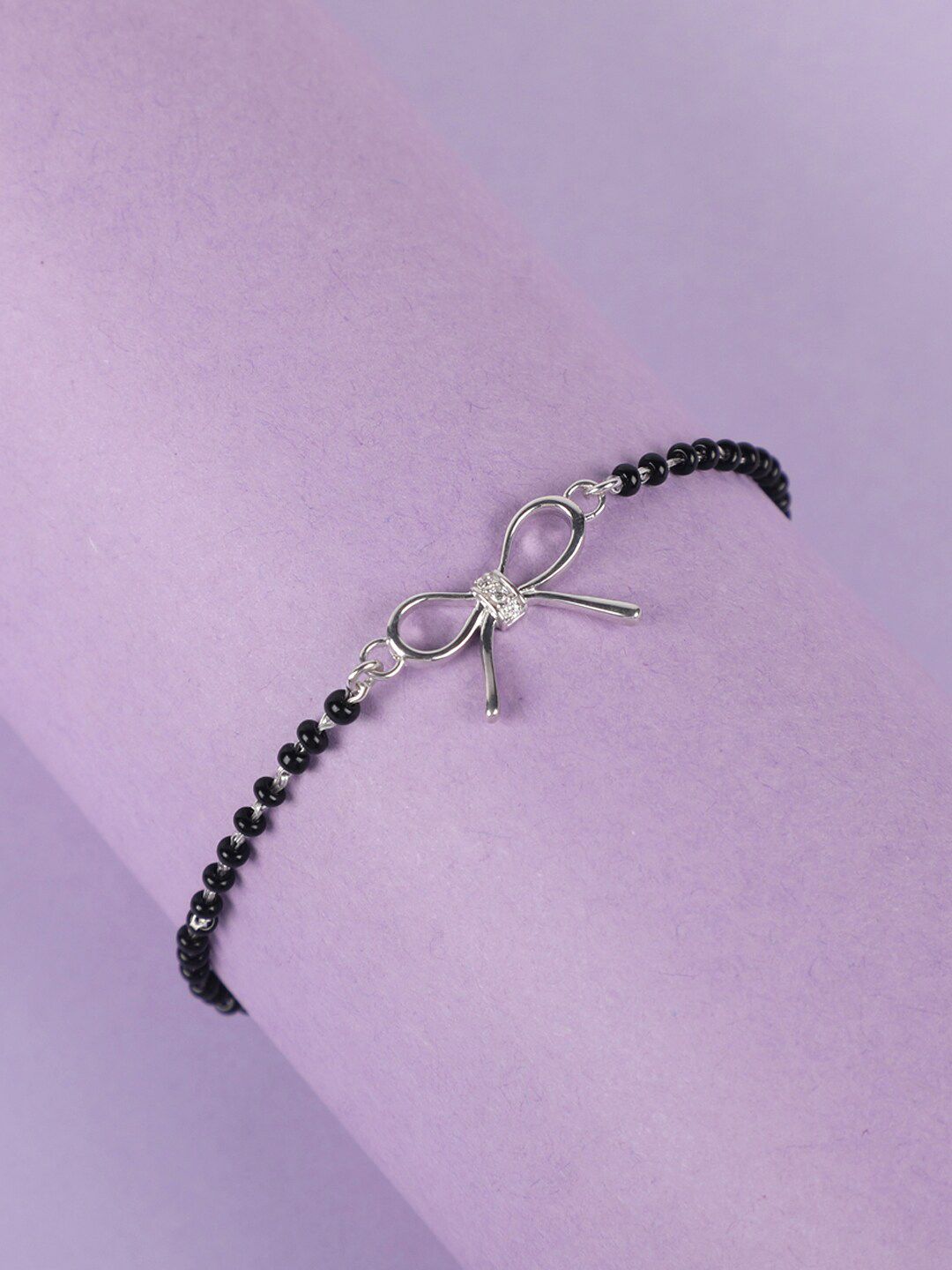 Clara Women Silver-Toned & Black Sterling Silver Rhodium-Plated Bow Mangalsutra Bracelet Price in India