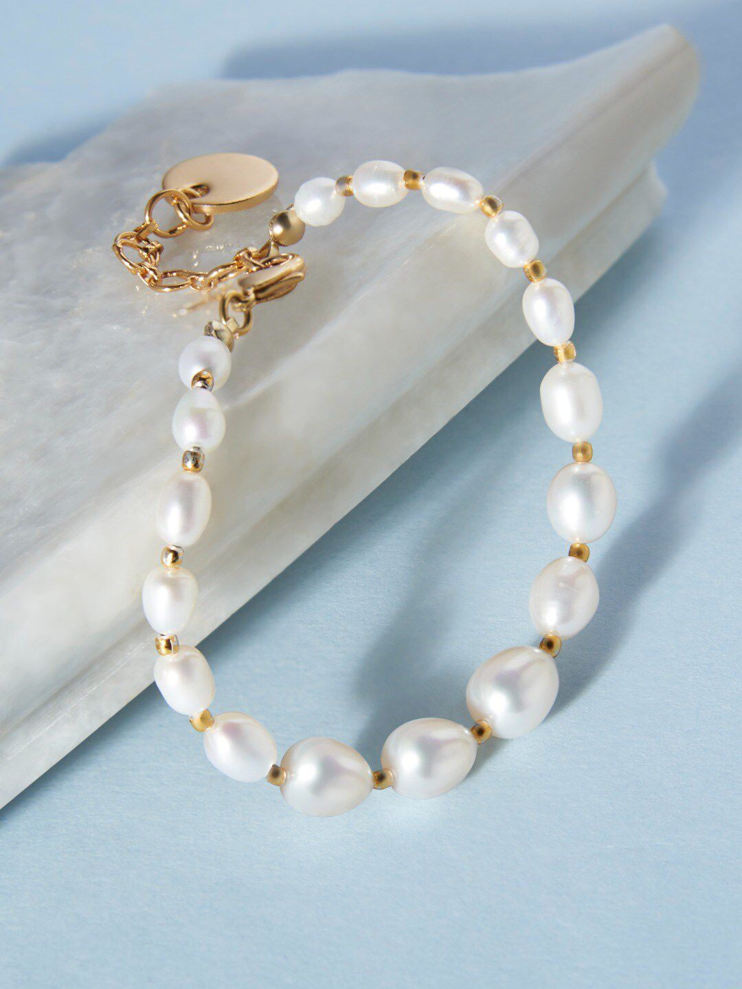 Zaveri Pearls Women White & Gold-Plated Freshwater Natural AAA+ Graduation Rice Bracelet Price in India