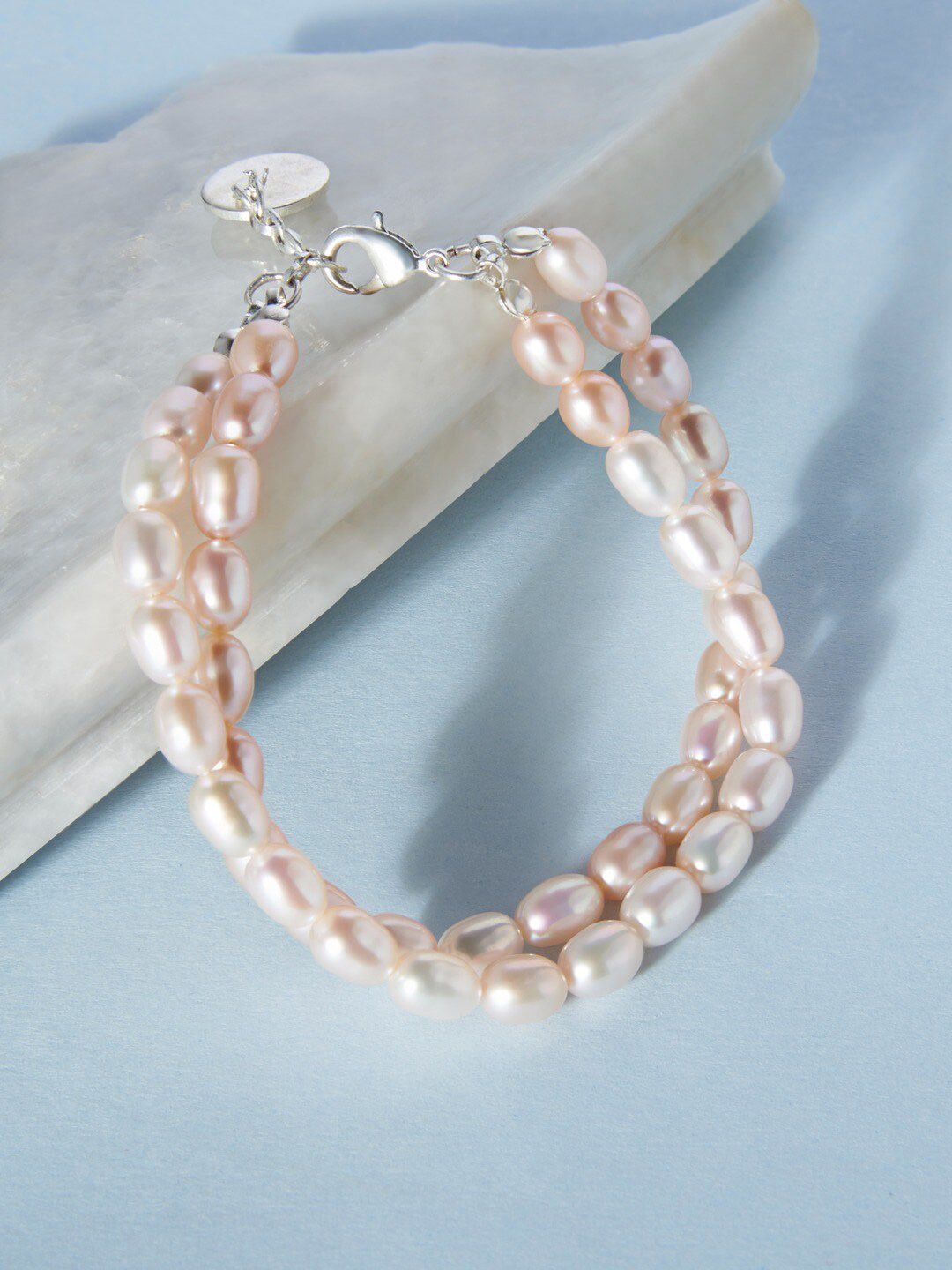 Zaveri Pearls Women Pink & Silver-Plated Multistrand Freshwater Natural Pearl Bracelet Price in India