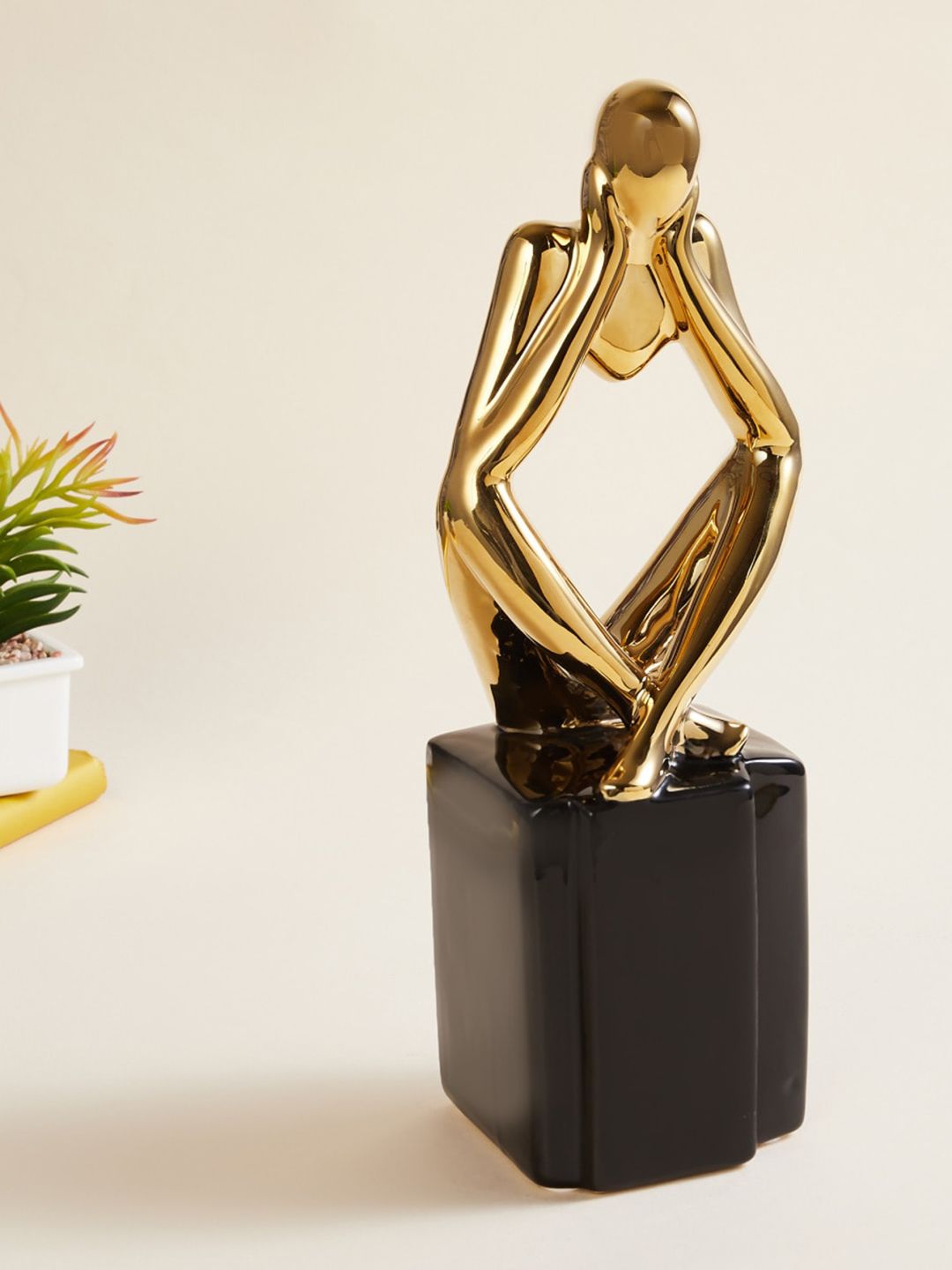 Home Centre Gold-Toned & Black Solid Sitting On Block Ceramic Figurine Showpieces Price in India