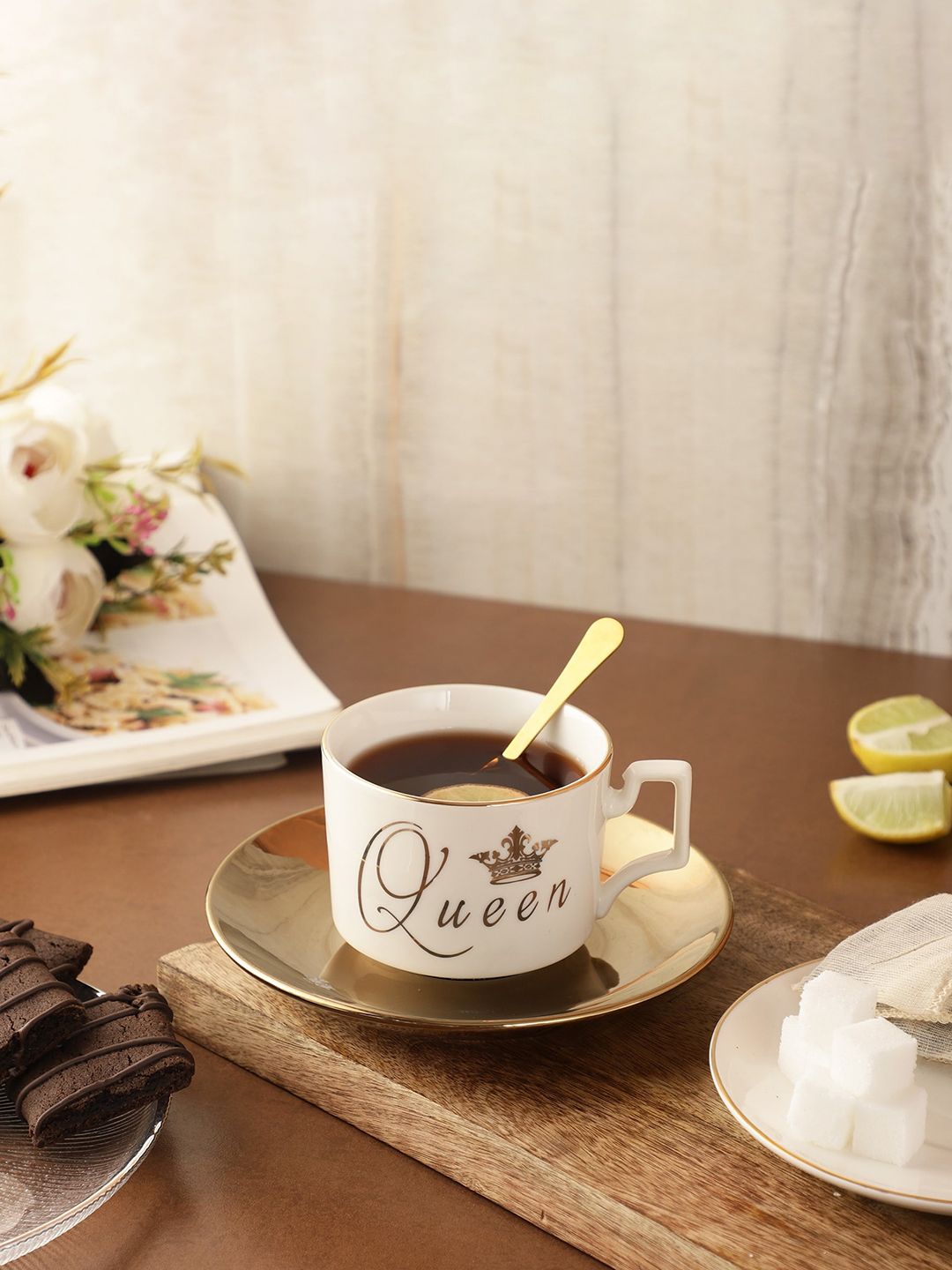 The Decor Mart Gold-Toned & White Text or Slogans Printed Ceramic Glossy Cup and Saucer Price in India