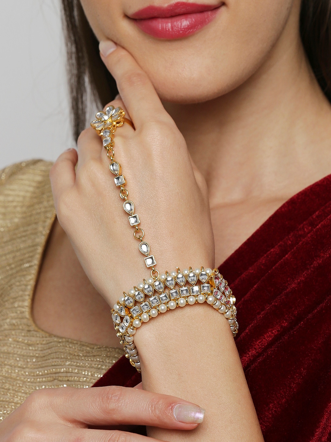 OOMPH Women Gold-Toned & White Kundan & Pearls Hathphool Bracelet with Ring Price in India