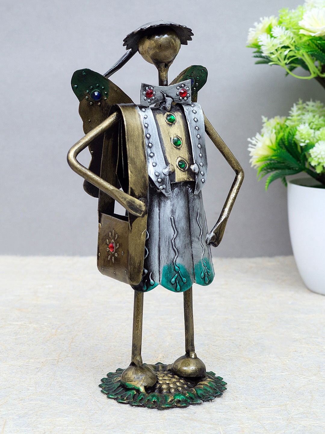 Golden Peacock Gold-Toned & Silver-Toned School Boy Iron Figurine Showpiece Price in India