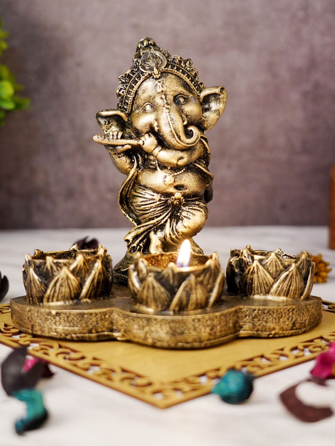 FASHIYANOO Grey & Gold-Toned Ganesh Idol T Light Candle holder Price in India