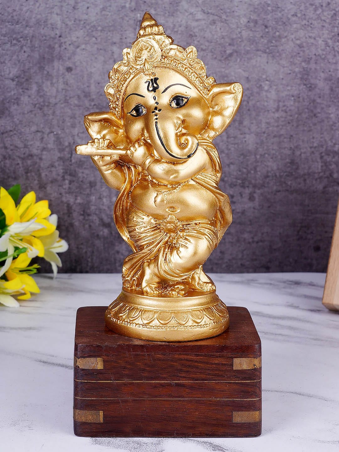 FASHIYANOO Gold-Toned Ganesh Idol With Bansuri Showpiece Price in India
