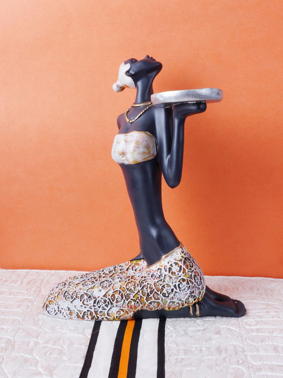 FASHIYANOO Black Sitting Doll With Silver Plate In Hand Showpiece Price in India