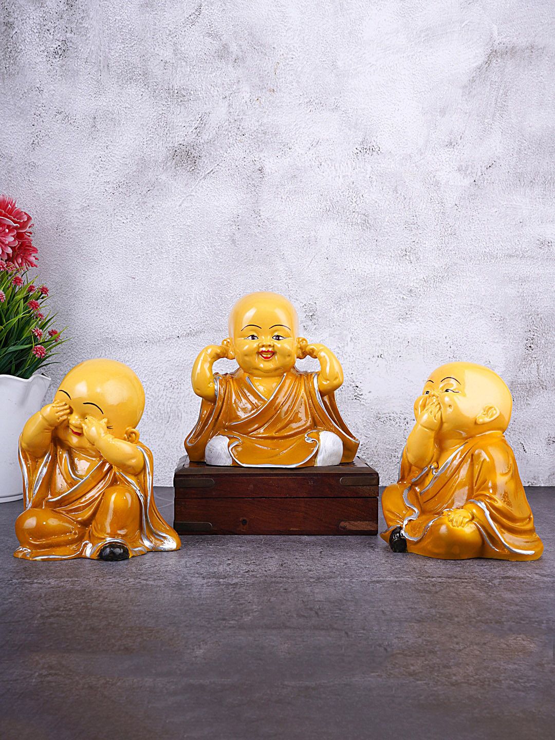 FASHIYANOO Set Of 3 Yellow Monk Showpieces Price in India
