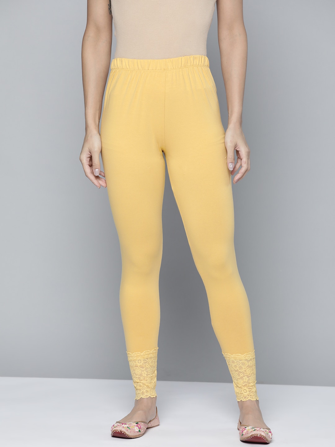 HERE&NOW Women Mustard Yellow Solid Ankle Length Hem Design Leggings Price in India