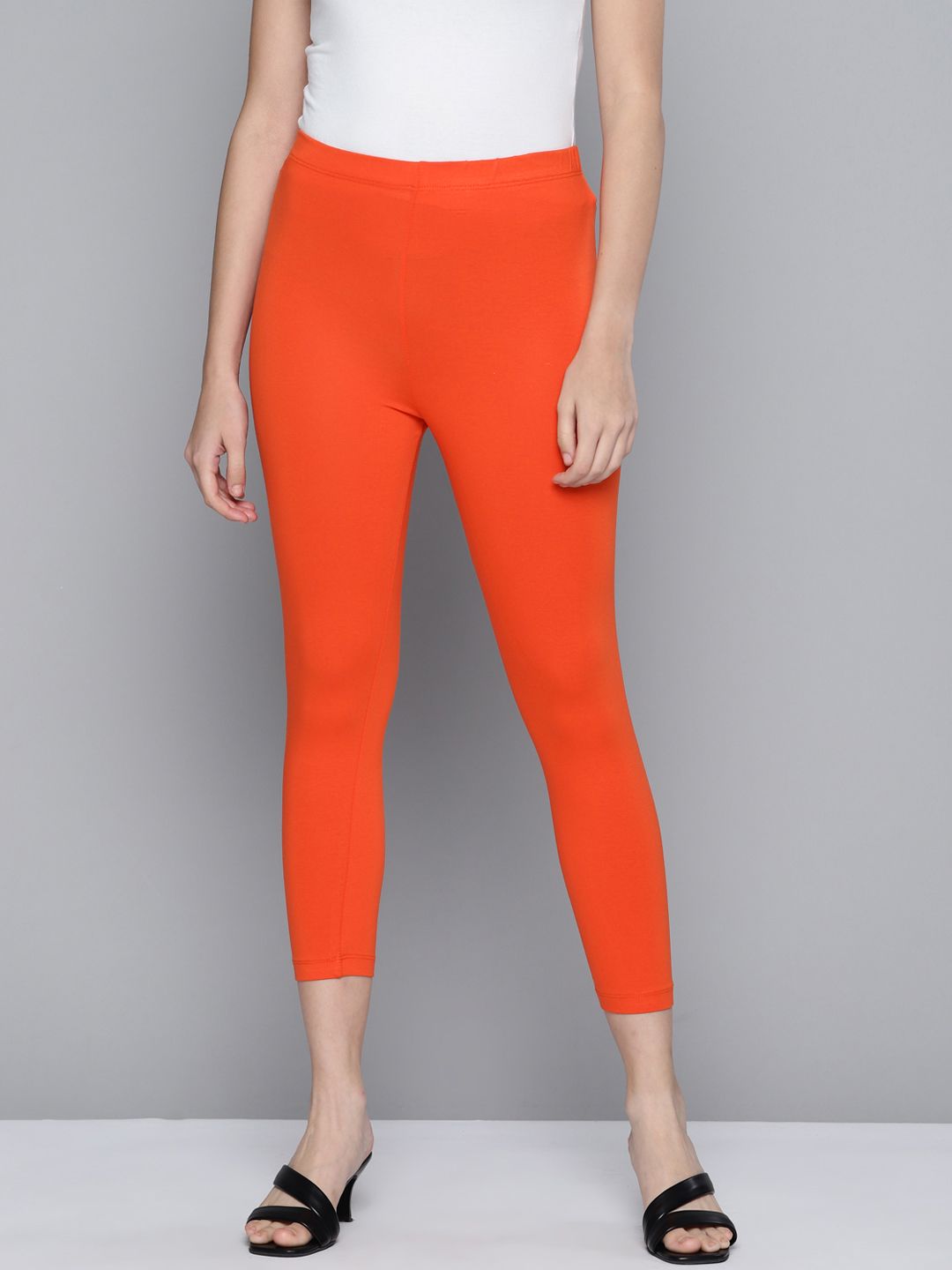 HERE&NOW Women Orange Solid Three-Fourth Length Leggings Price in India