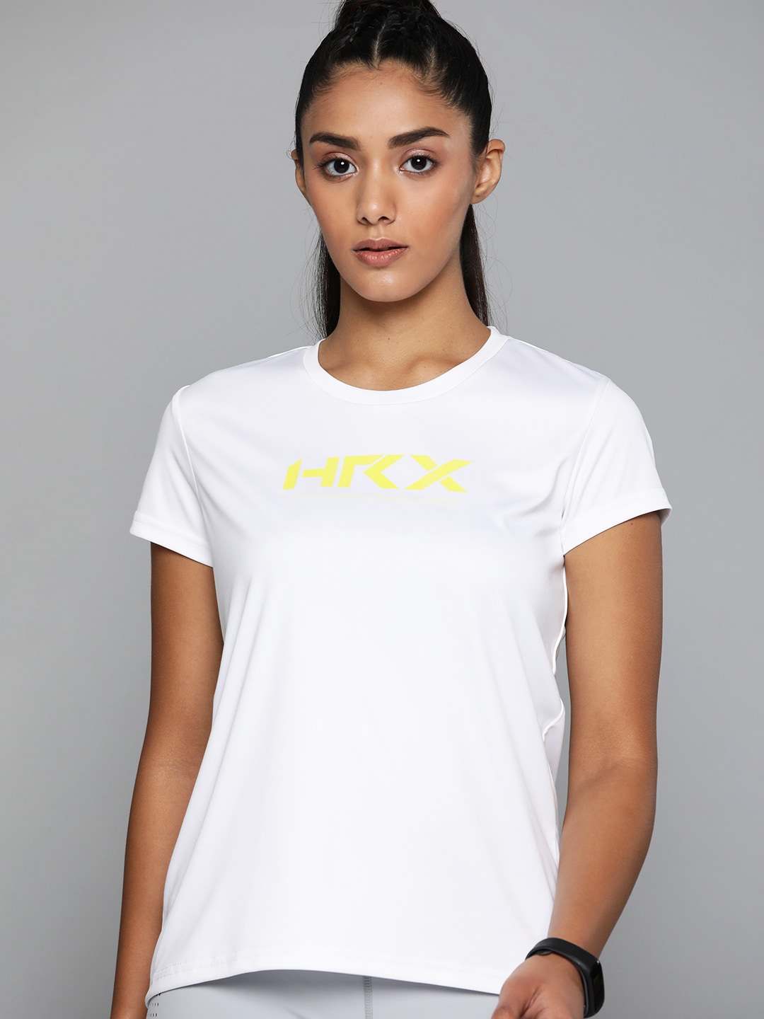 HRX by Hrithik Roshan Training Women OPTIC WHITE Rapid-Dry Brand Carrier Tshirts Price in India