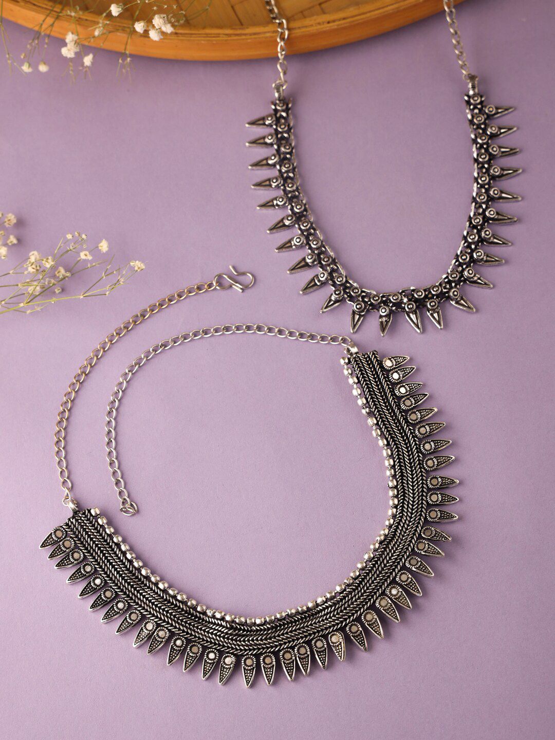 VIRAASI Pack of 2 Silver-Toned Brass Oxidised Choker Necklaces Price in India