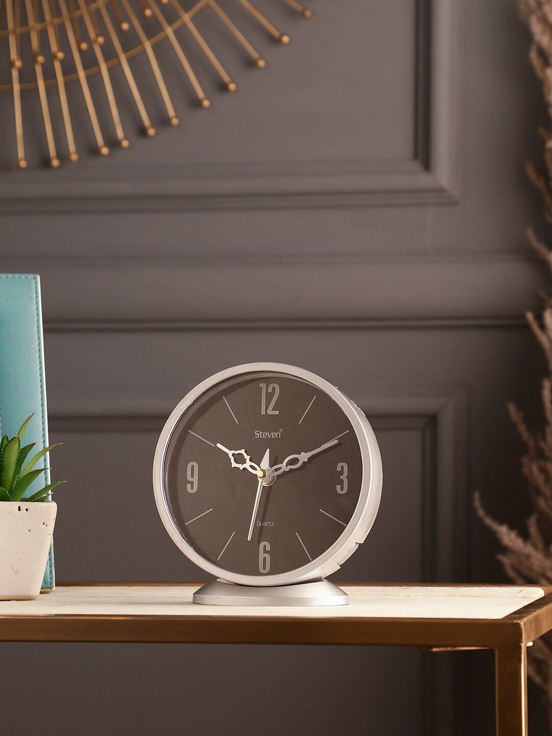 EXIM DECOR Silver-Toned & Black Analog Traditional Table Clock Price in India