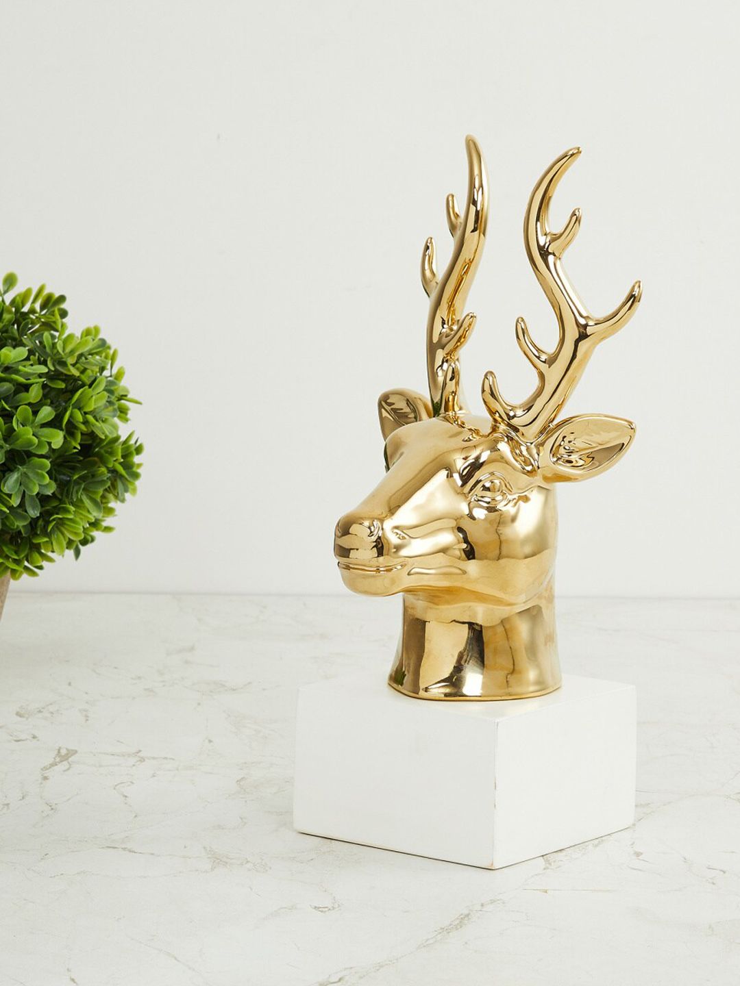 Home Centre Gold-Toned & White Reindeer Decor Figurine Showpiece Price in India