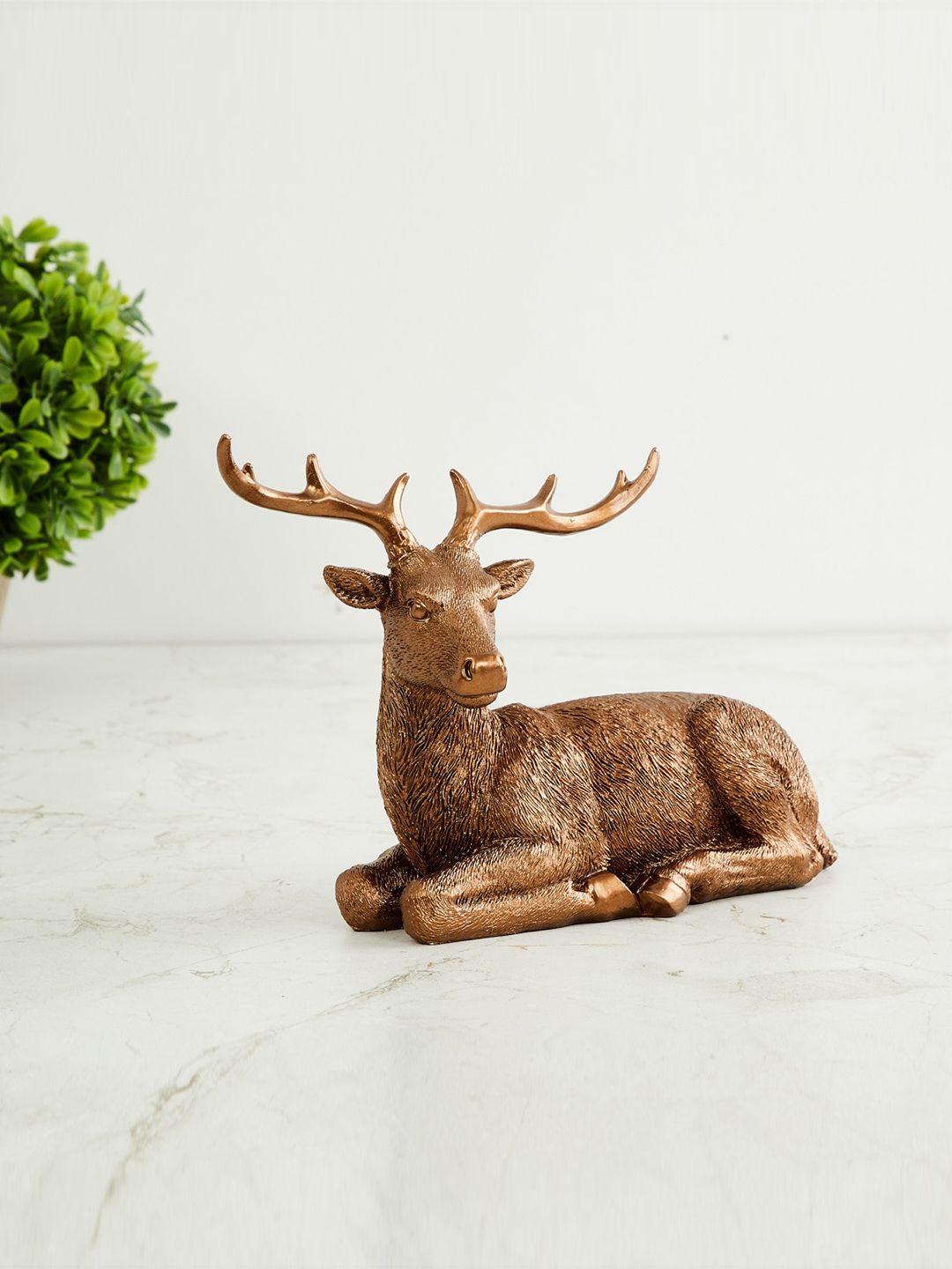 Home Centre Gold-Toned Textured Sitting Deer Figurine Showpiece Price in India