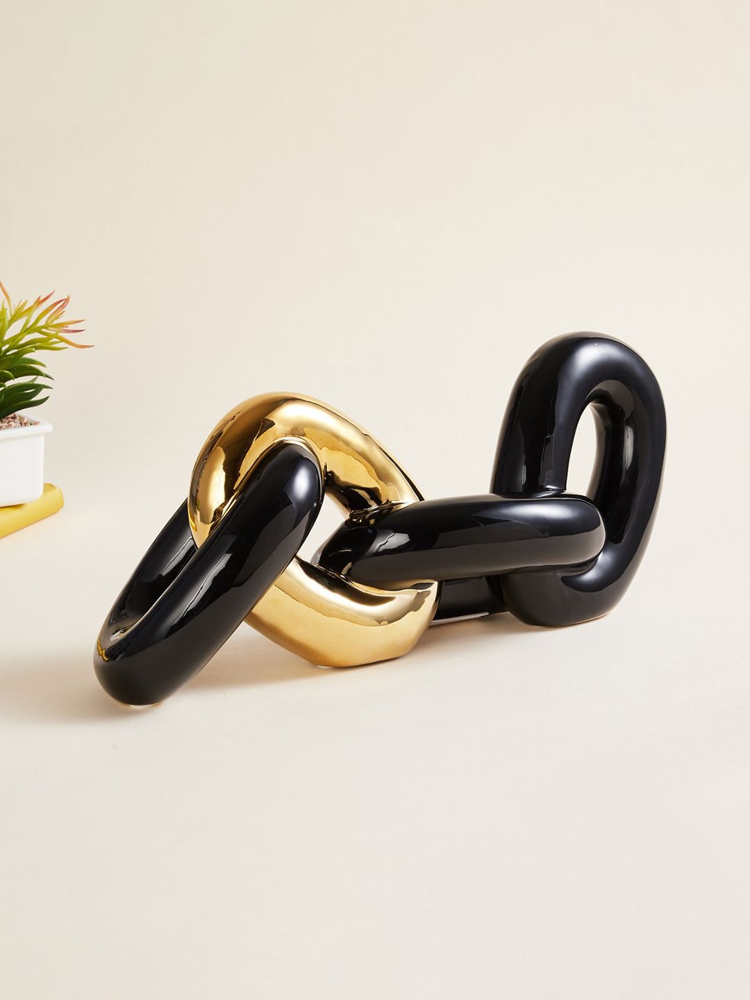 Home Centre Black & Gold Loop Chain Showpiece Price in India