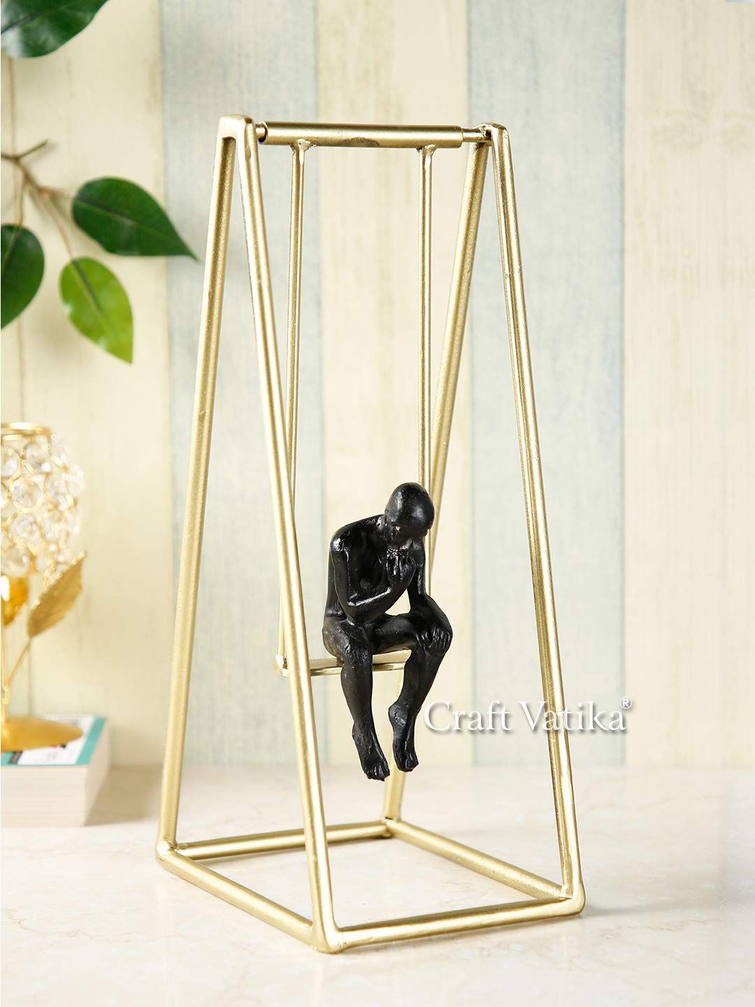 CraftVatika Black & Gold-Toned Thinker Man On Swing Showpiece Price in India