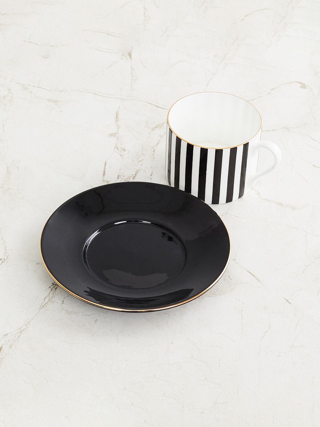 Home Centre White & Black Printed Bone China Glossy Cup and Saucer Set Price in India