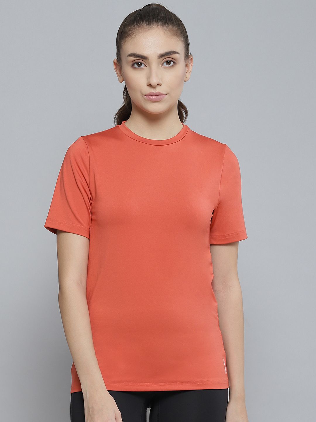 Reebok Women Coral Orange WOR Speedwick Training or Gym T-shirt Price in India