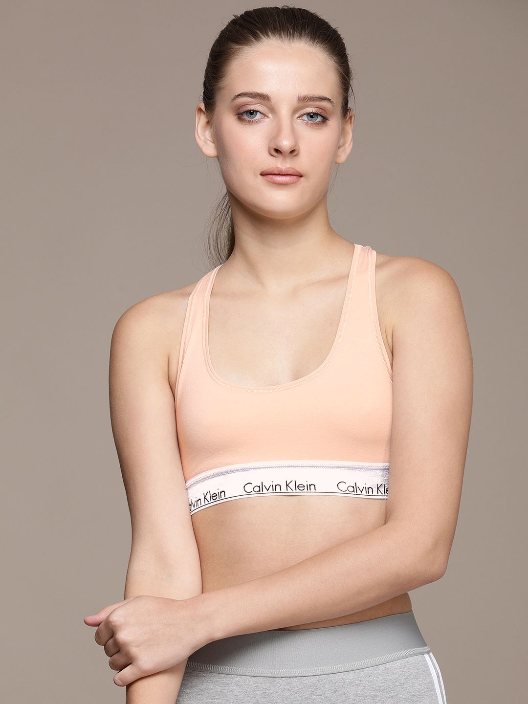 Calvin Klein Underwear Women Beige Solid Non-Padded Sports Bra QF6127VJS Price in India