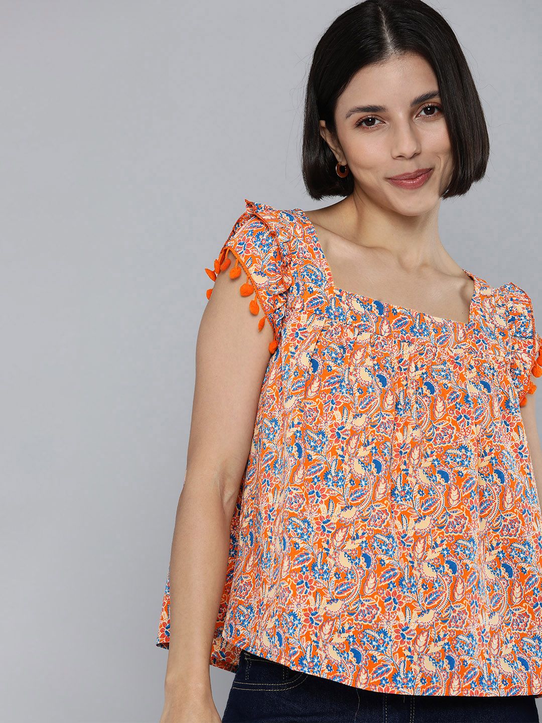 Mast & Harbour Women Orange & Blue Printed Top With PoM Pom Detail Price in India