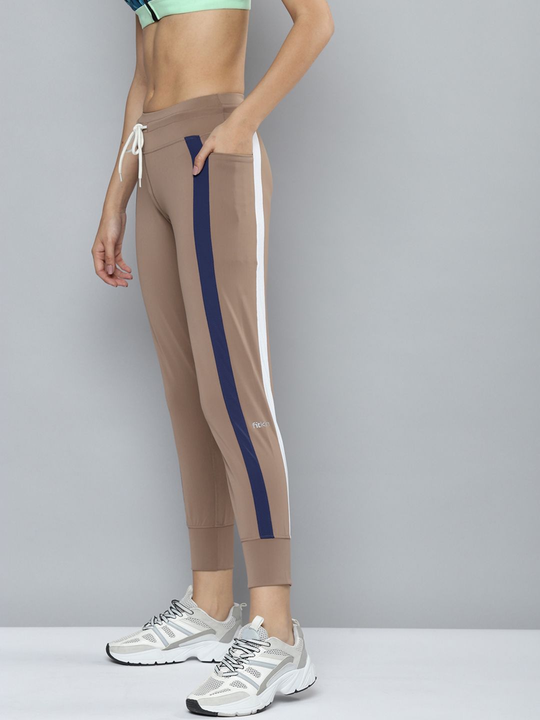 Fitkin Women Brown & Navy Blue Striped Rapid-Dry Training Joggers Price in India