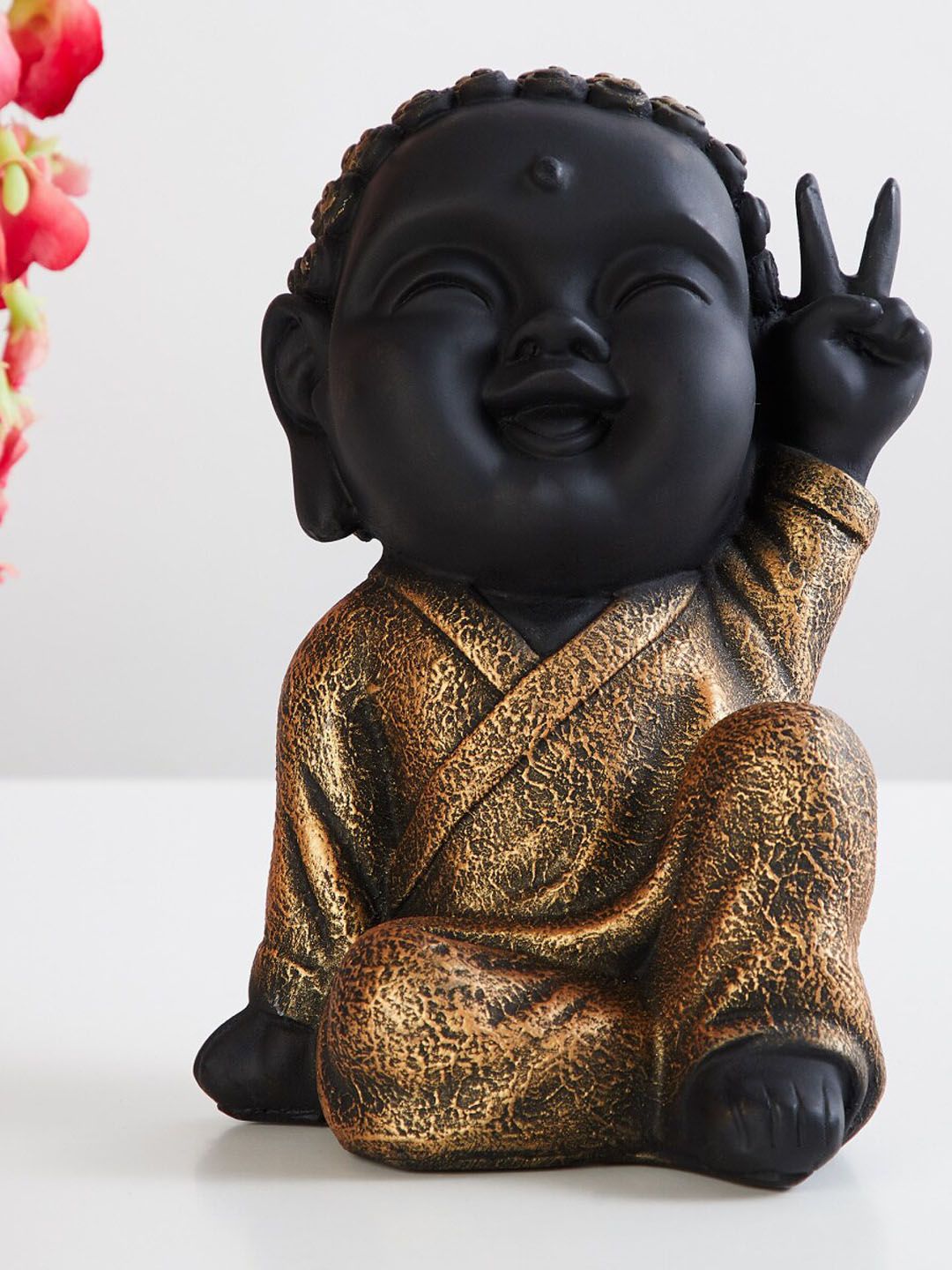 Home Centre Black & Copper-Toned Textured Corsica Baby Buddha Figurine Showpiece Price in India