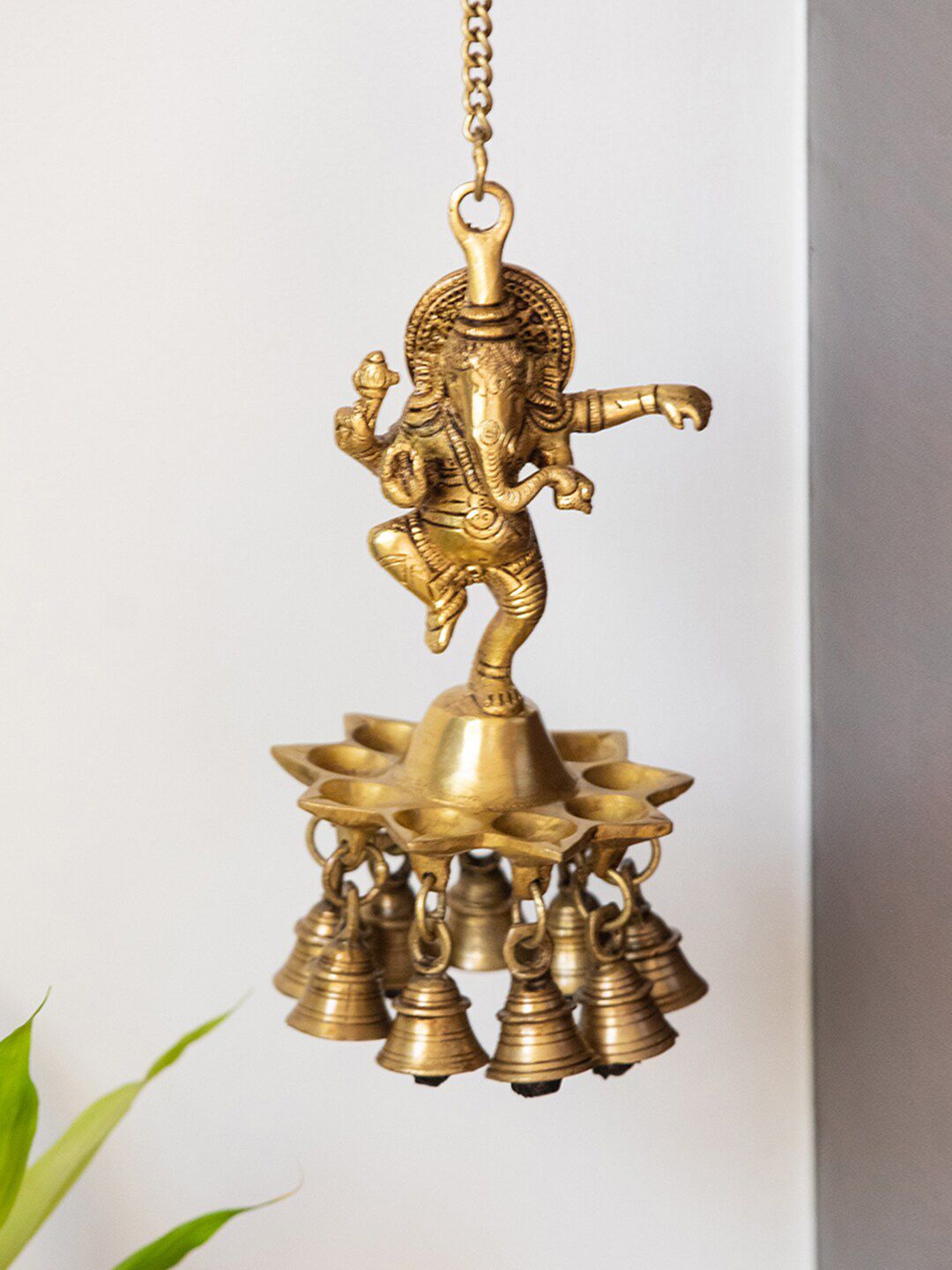 ExclusiveLane Gold Toned Swaying Ganesha Hand Etched Decorative Hanging Diya With Bell Price in India