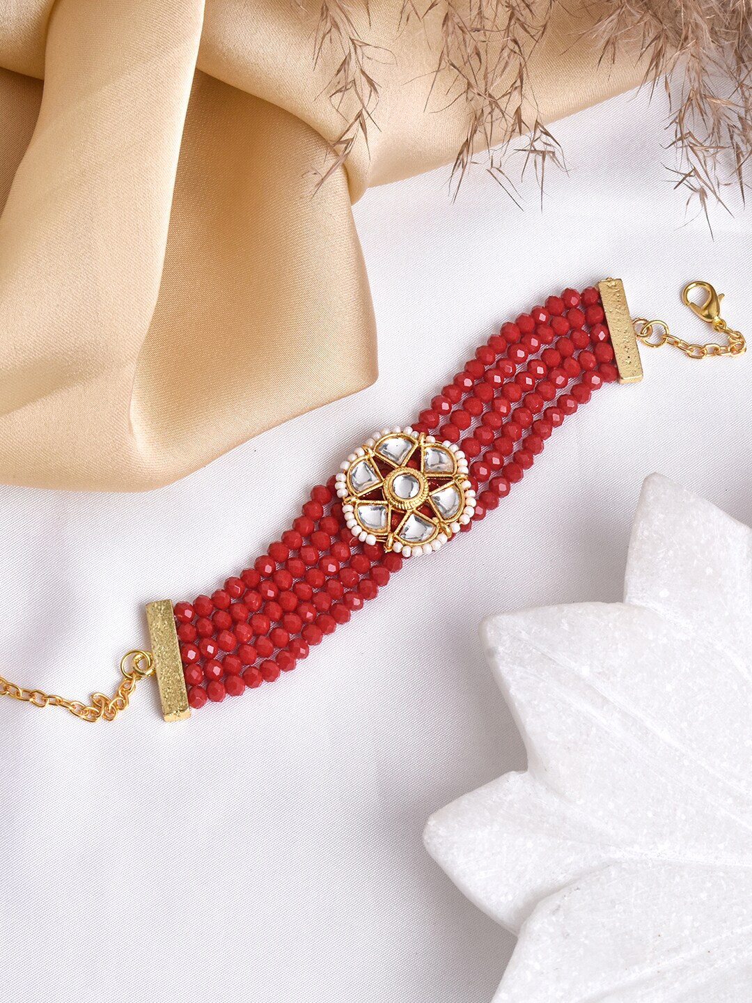 TEEJH Women Gold-Toned & Red Brass Multistrand Bracelet Price in India