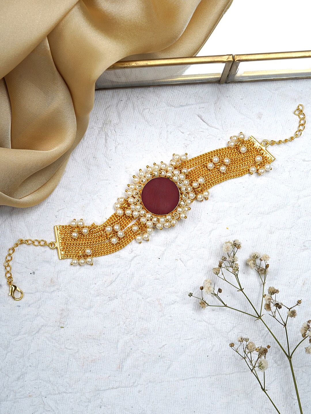 TEEJH Women Gold-Toned & Red Brass Multistrand Bracelet Price in India