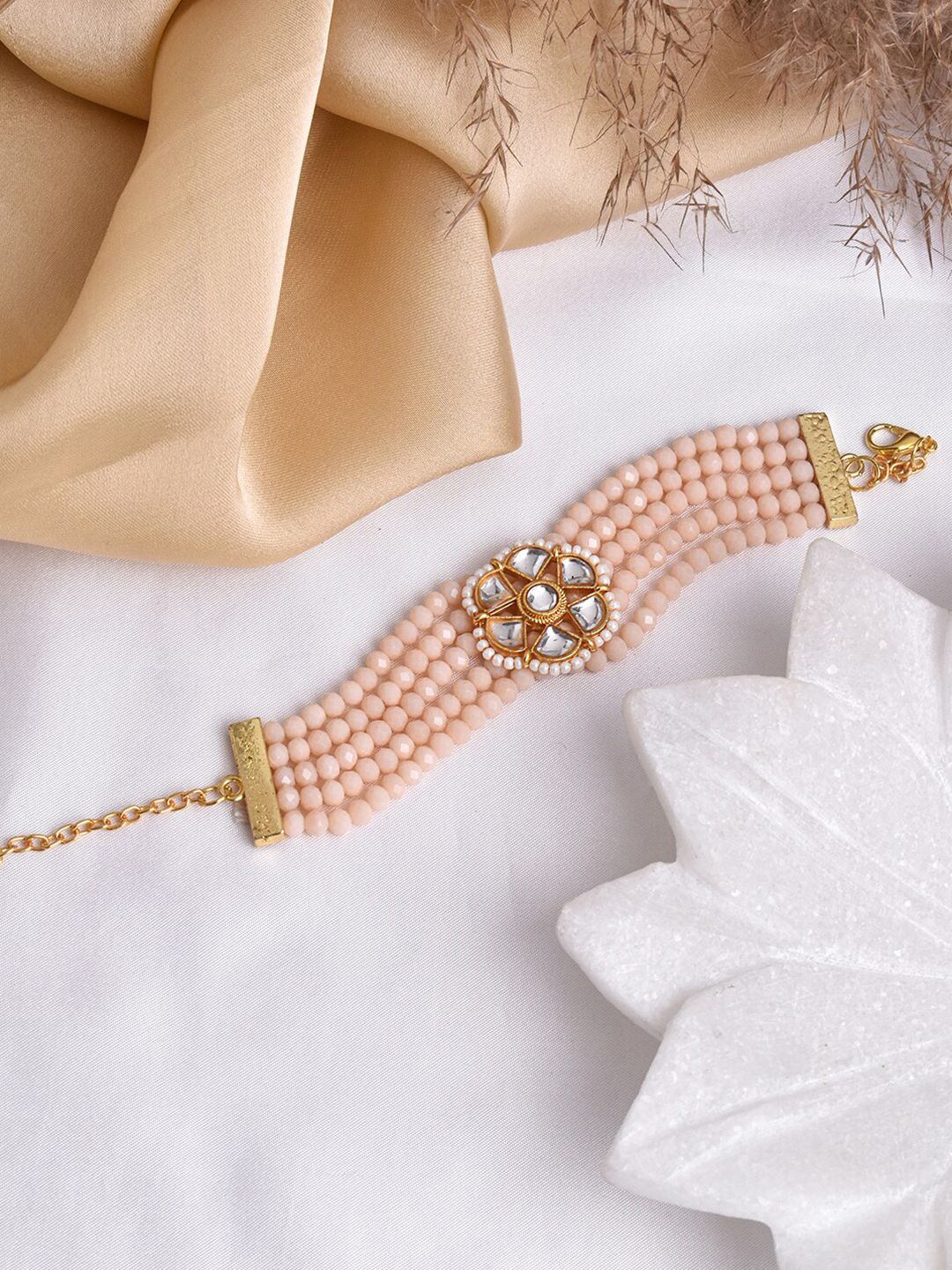TEEJH Women Gold-Toned & Pink Brass Multistrand Bracelet Price in India