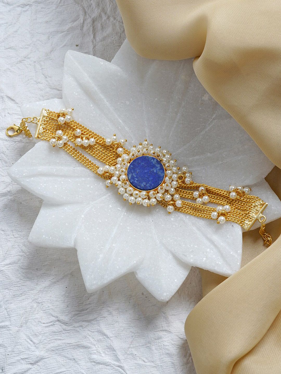 TEEJH Women Gold-Toned & Blue Brass Charm Bracelet Price in India