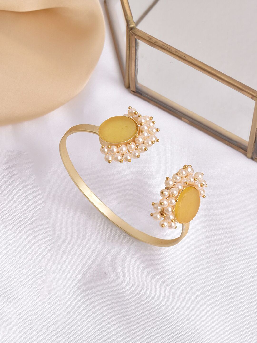 TEEJH Women Gold-Toned & White Brass Pearl Studded Cuff Bracelet Price in India