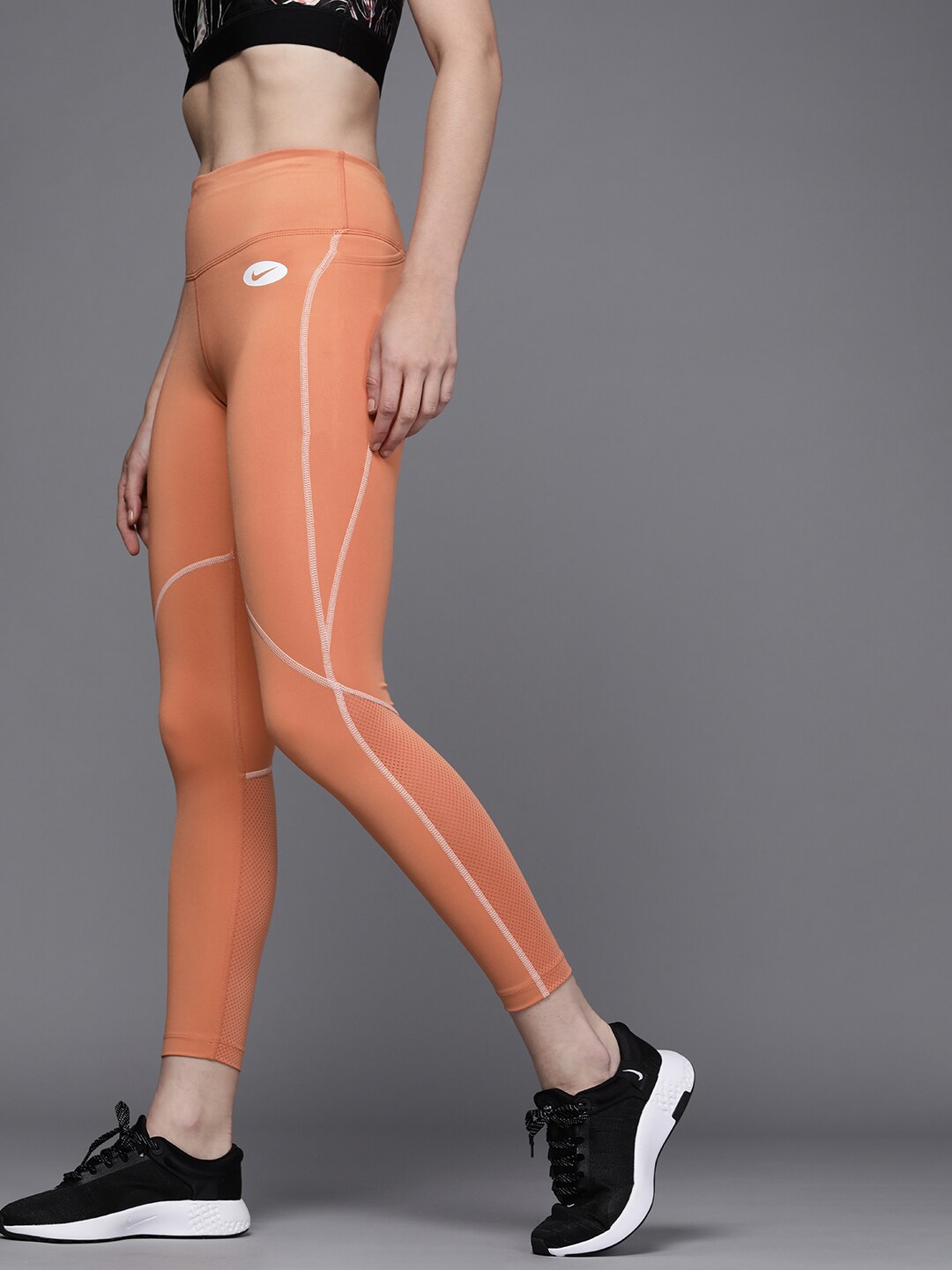 Nike Women Orange Solid Dri-Fit Icon Clash Mid-Rise Running Tights Price in India