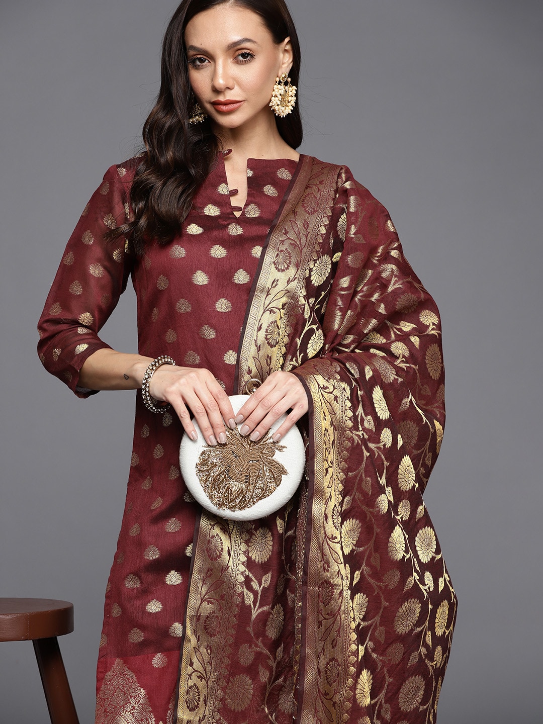 Inddus Maroon & Golden Unstitched Dress Material Price in India