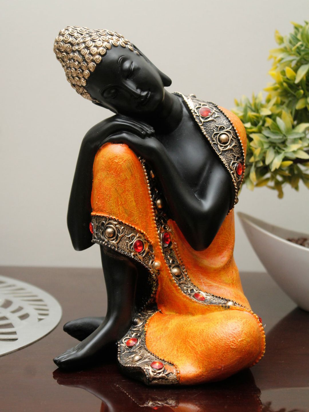 StatueStudio Orange & Black Thinking Buddha Showpiece Price in India