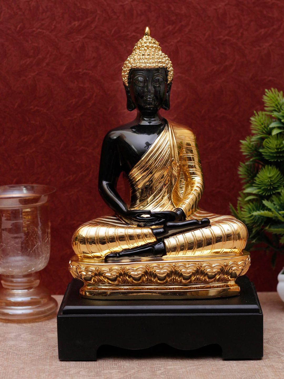 StatueStudio Black & Gold Buddha Polyresin Showpieces Price in India