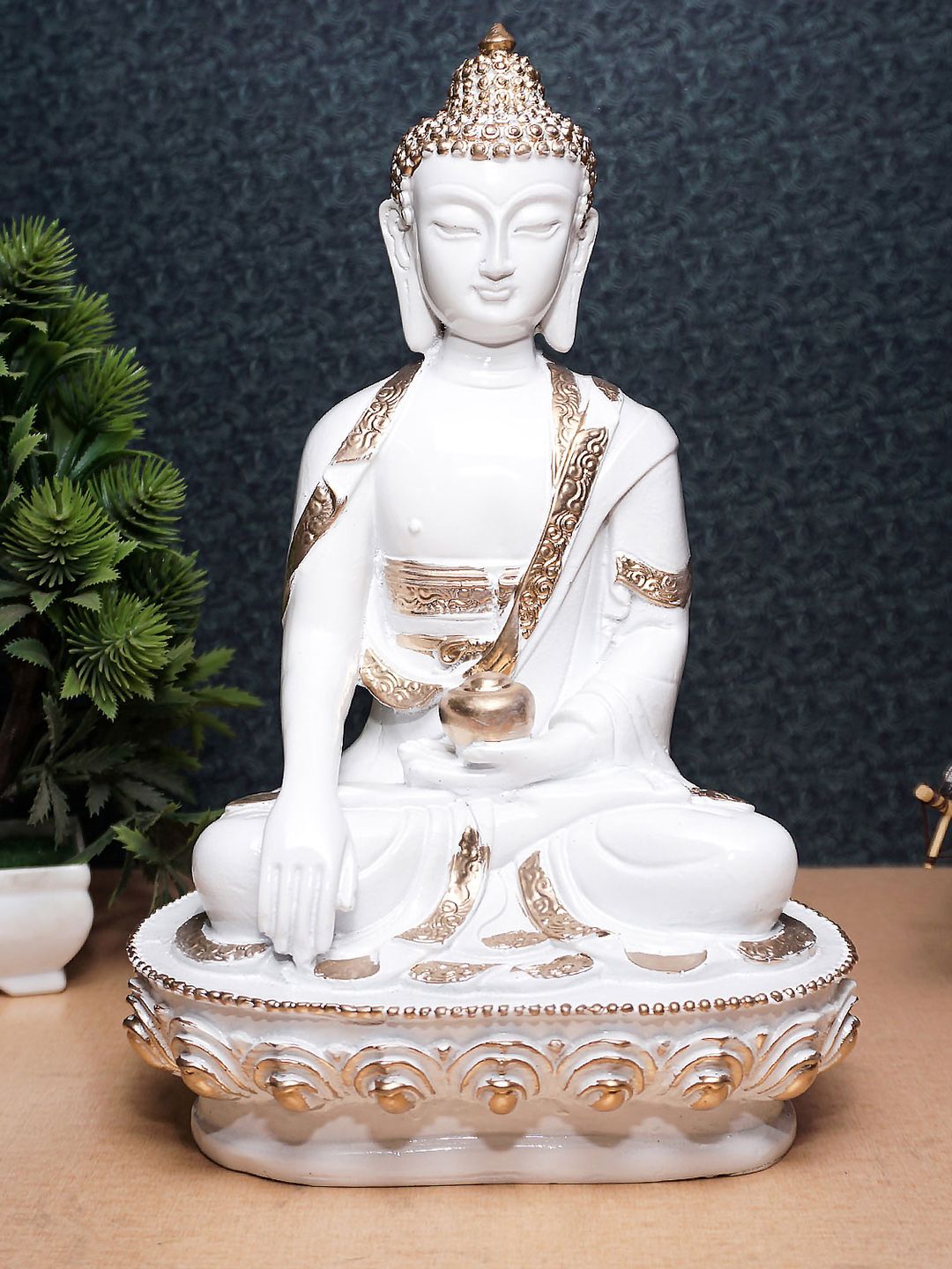 StatueStudio White & Gold-Toned Textured Buddha Showpiece Price in India