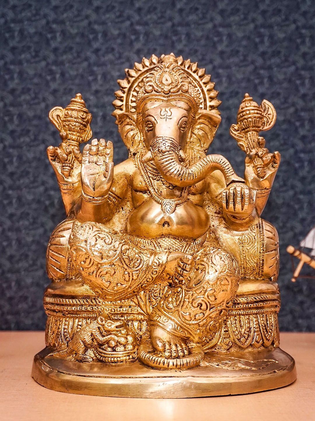 StatueStudio Gold-Toned Ganpati Sitting On Singhasan Showpiece Price in India