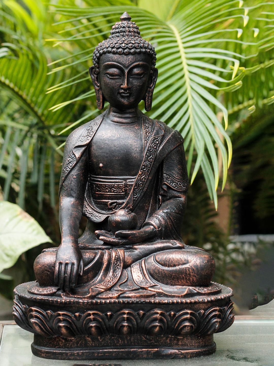 StatueStudio Copper-Toned & Black Textured Antique Buddha Showpiece Price in India