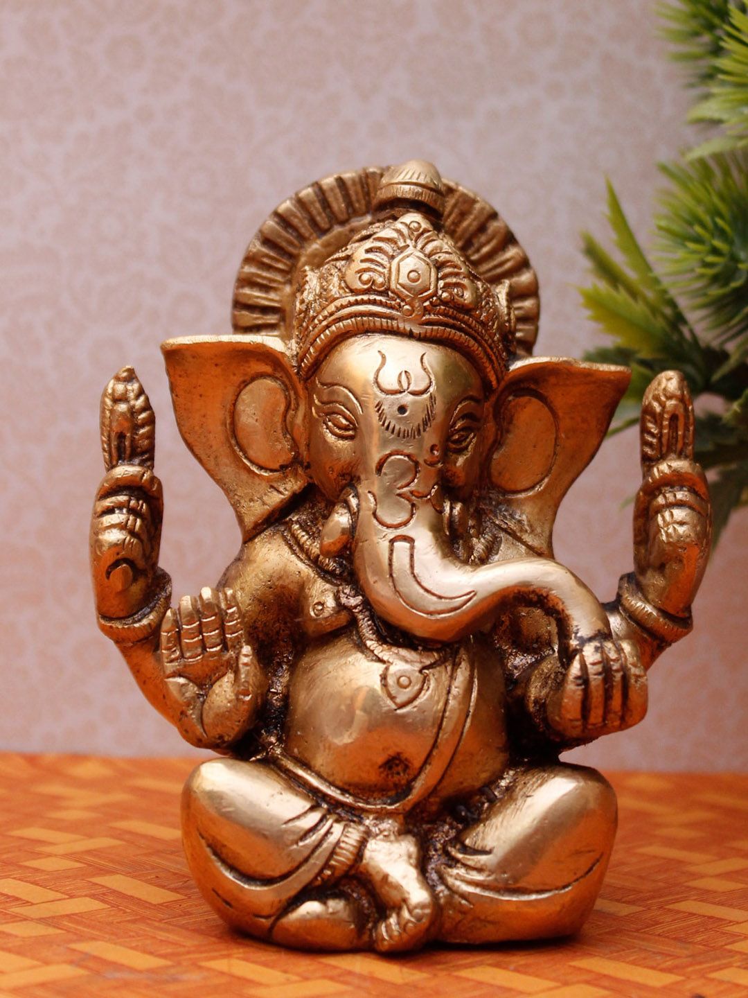 StatueStudio Gold Toned Sitting Ganesha Figurine Showpieces Price in India