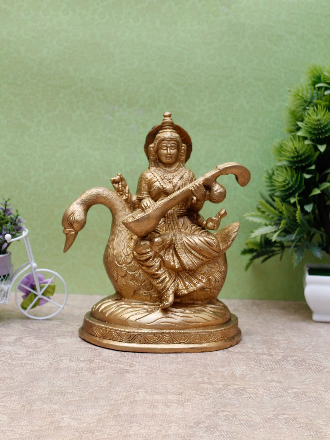 StatueStudio Gold-Toned Textured Brass Goddess Saraswati Showpiece Price in India