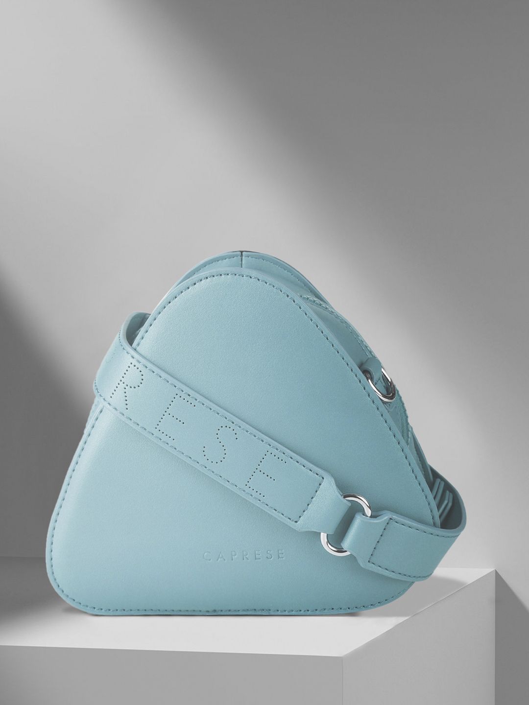 Caprese Blue Solid Structured Sling Bag Price in India