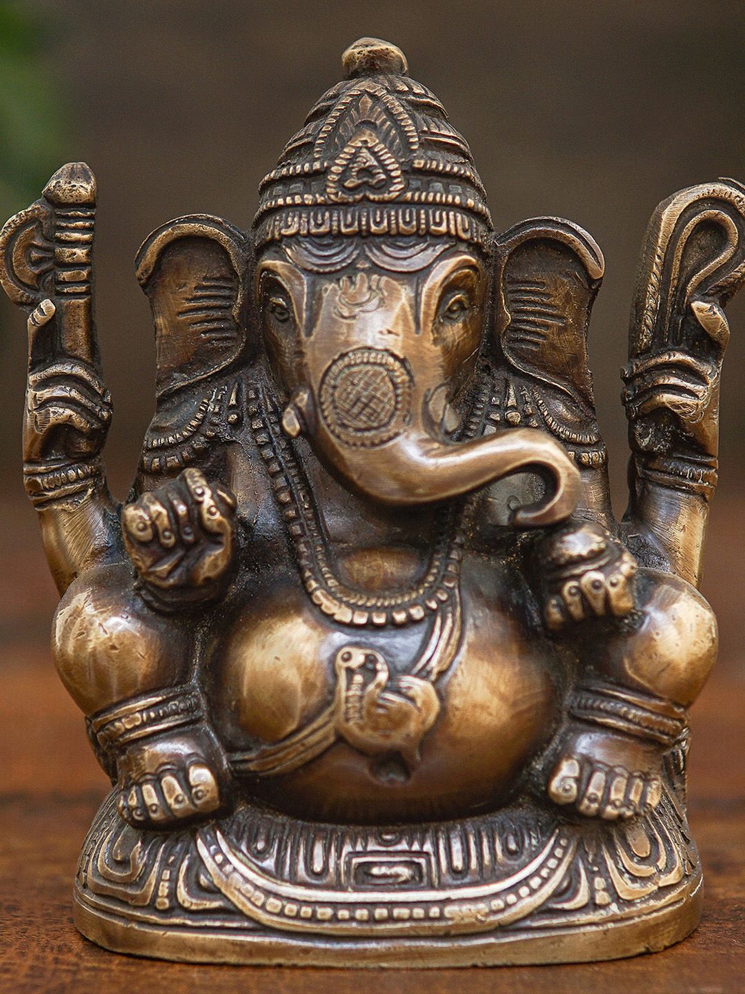 StatueStudio Bronze-Toned Ganesha Idol Showpiece Price in India